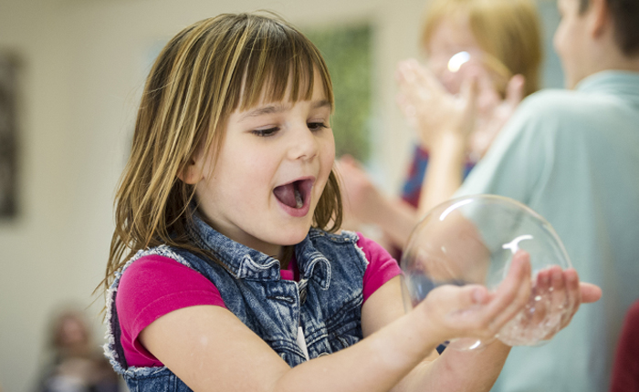 Child Holding Bubble